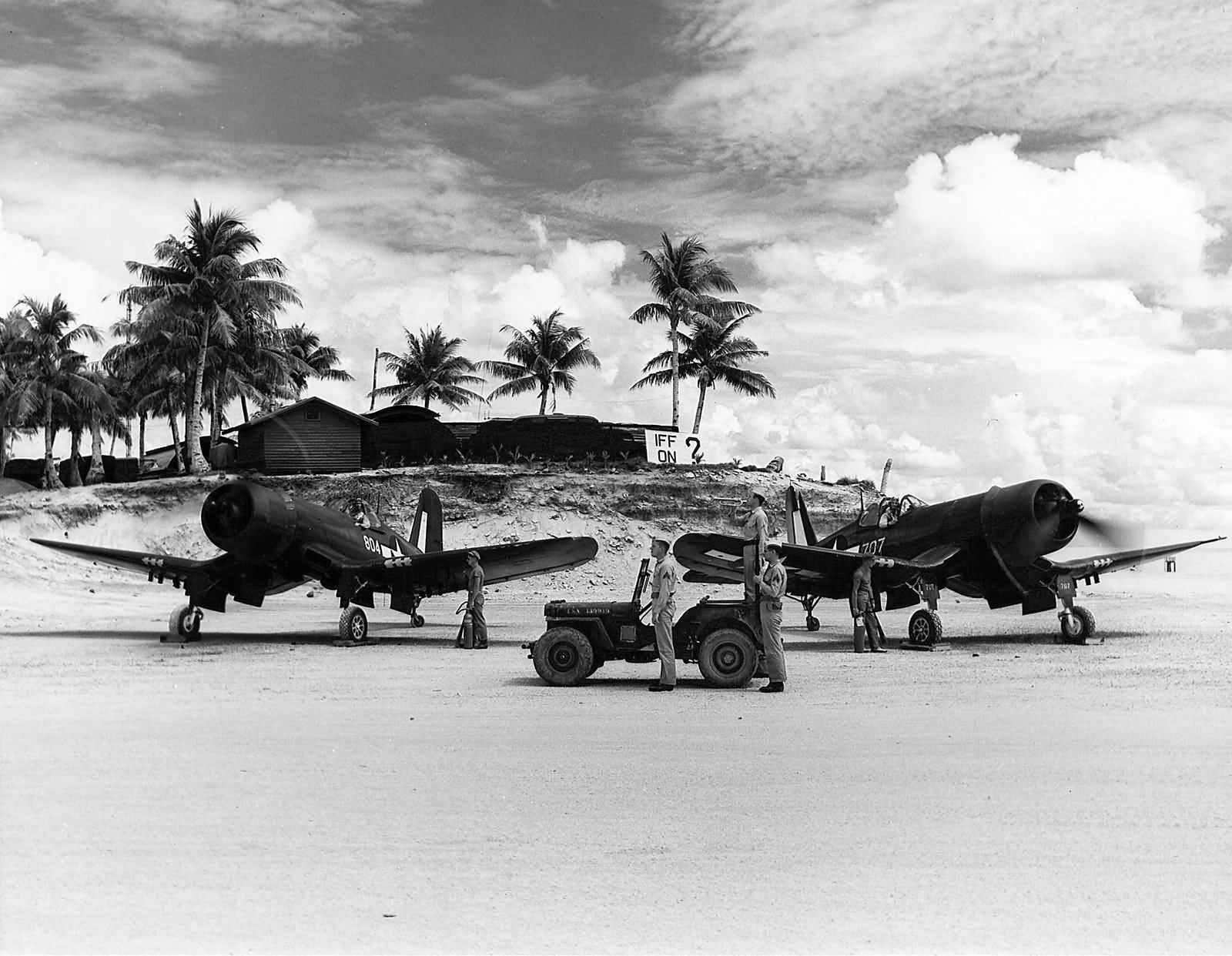 F4U Corsairs 804 707 of VMF-122 ready for take off on an airfield in the Palau Islands 1945