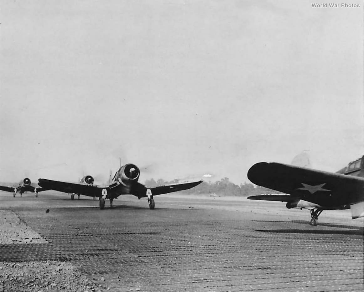 F4U-1 of VMF-124 taxi down runway on Henderson Field 1943