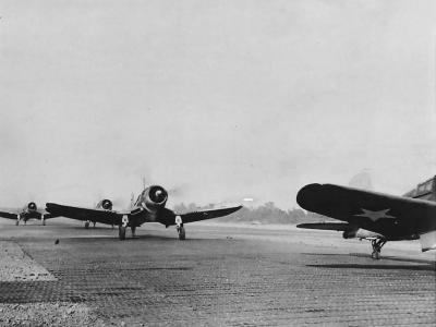 F4U-1 of VMF-124 taxi down runway on Henderson Field 1943