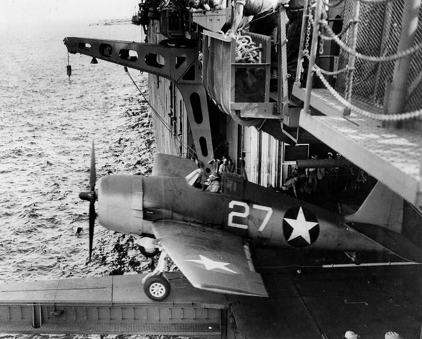 F6F-3 Hellcat #27 of VF-1 launches from the hangar deck catapult on board the carrier USS Yorktown (CV-10) June 3, 1943