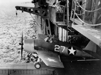 F6F-3 Hellcat #27 of VF-1 launches from the hangar deck catapult on board the carrier USS Yorktown (CV-10) June 3, 1943