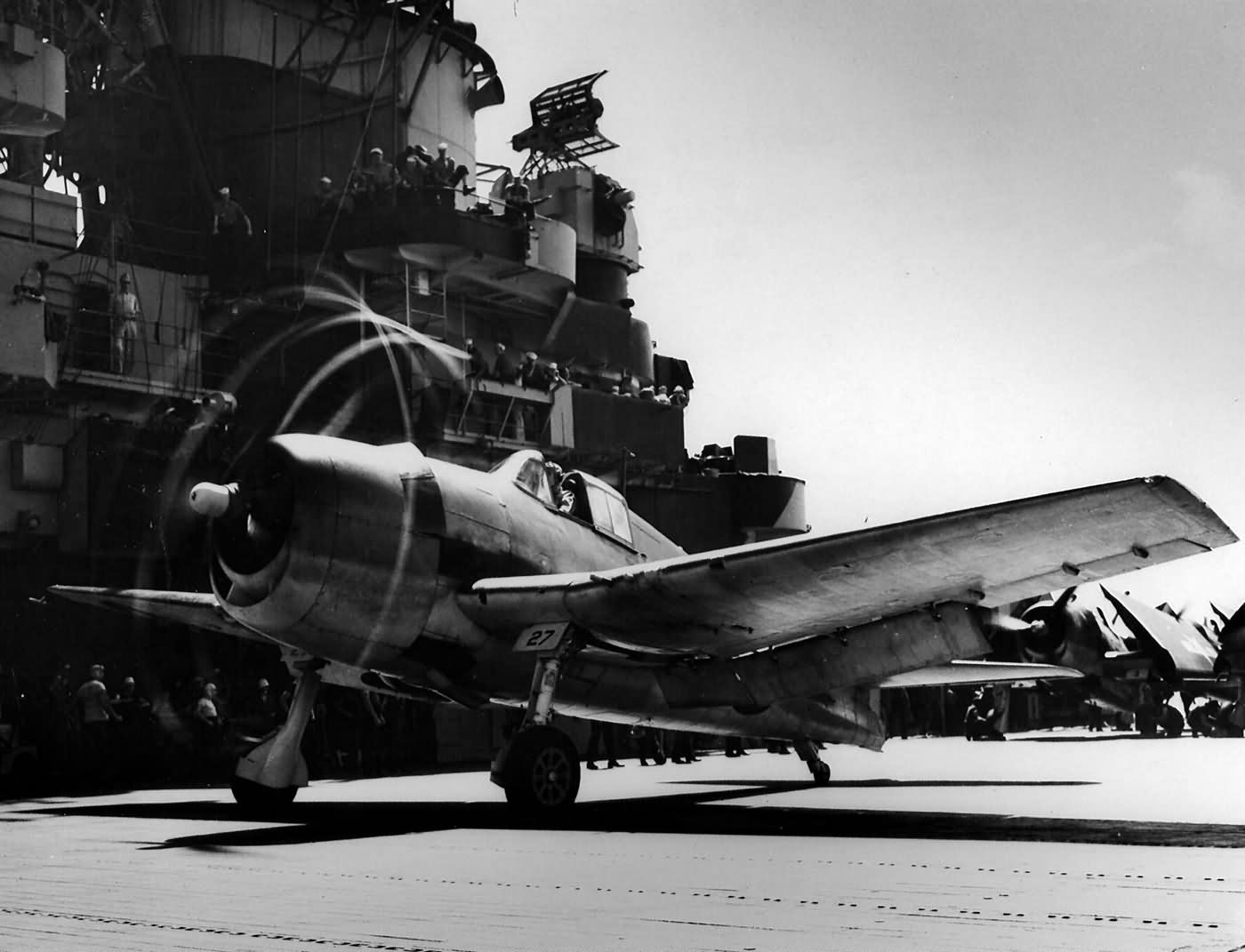 F6F-3 Hellcat #27 of VF-7 before launching from the flight deck of the carrier USS Hancock (CV-19) – June 27, 1944