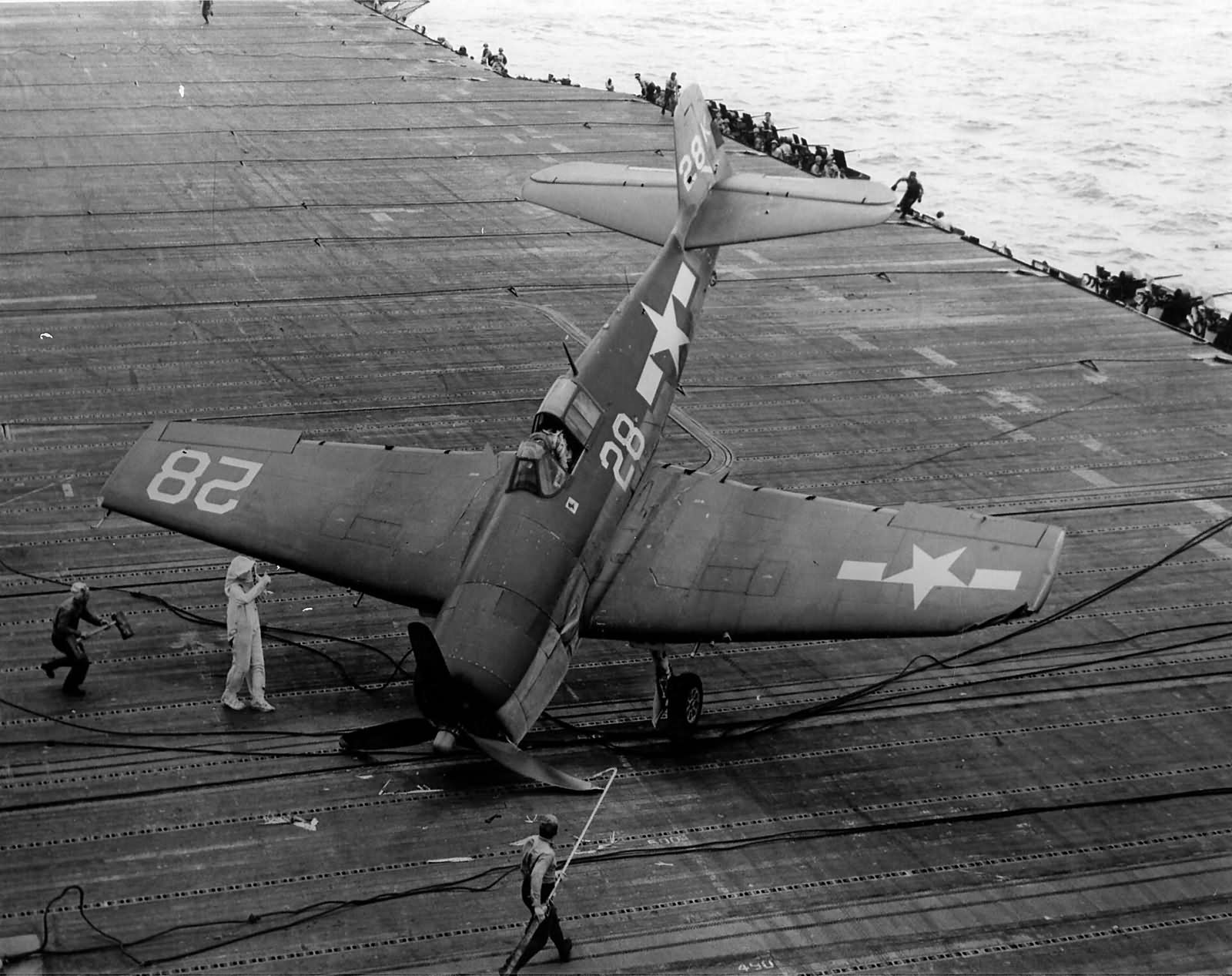 F6F-3 Hellcat #28 of VF-1 after engaging the barricade on the flight deck of the carrier USS Hornet CV-12 Battle of the Philippine Sea on June 19, 1944