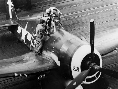 F6F-5P Hellcat #135 of VF-84 on the flight deck of the aircraft carrier Bunker Hill (CV-17) February 19, 1945 Iwo Jima