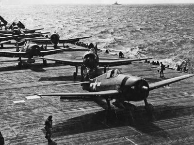 F6F-5 Hellcats of VF-80 prepare to launch from the aircraft carrier Ticonderoga CV-14 November 6, 1944. Hellcat #48 in foreground