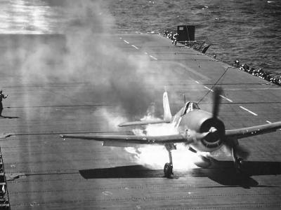 F6F Hellcat burning on deck of carrier USS Cowpens