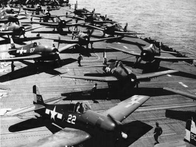 F6F Hellcats of VF 17 and VBF 17 on the flight deck of the aircraft carrier USS Hornet CV 12 March 16 1945