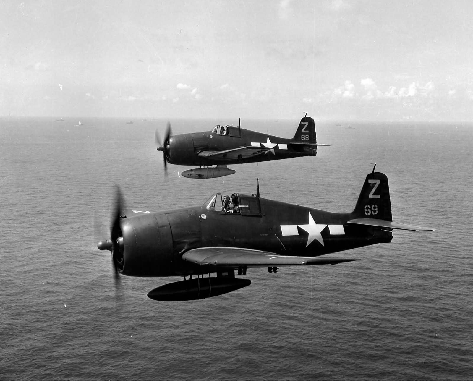 F6F Hellcats #68, #69 of VF-85 USS Shangri-La CV-38 in flight near Japan on August 17, 1945