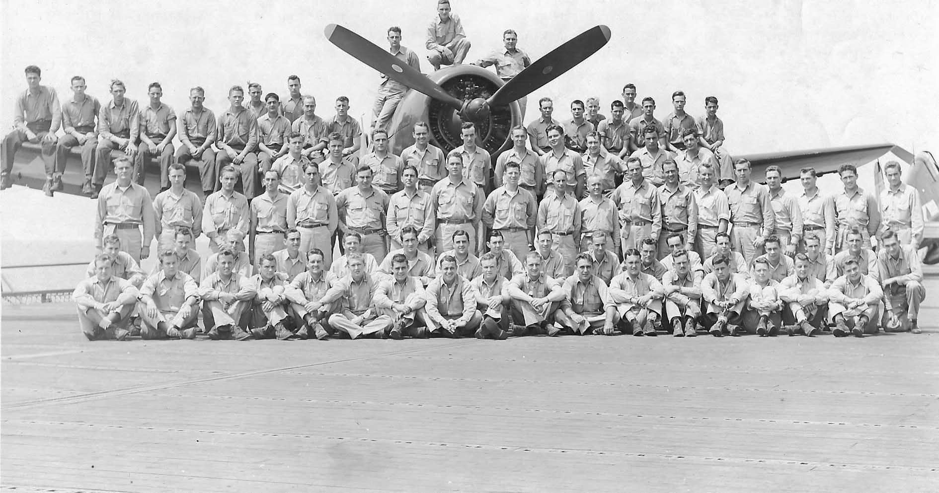 Group photograph of the VF-86 with one of their F6F-5 Hellcats on board the carrier Wasp CV-18 – July 17, 1945