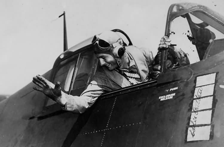 Lt Cdr Edward Outlaw waves from the cockpit of his F6F-3 Hellcat