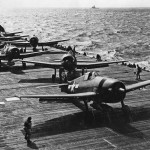 F6F-5 Hellcats of VF-80 prepare to launch from the aircraft carrier Ticonderoga CV-14 November 6, 1944. Hellcat #48 in foreground