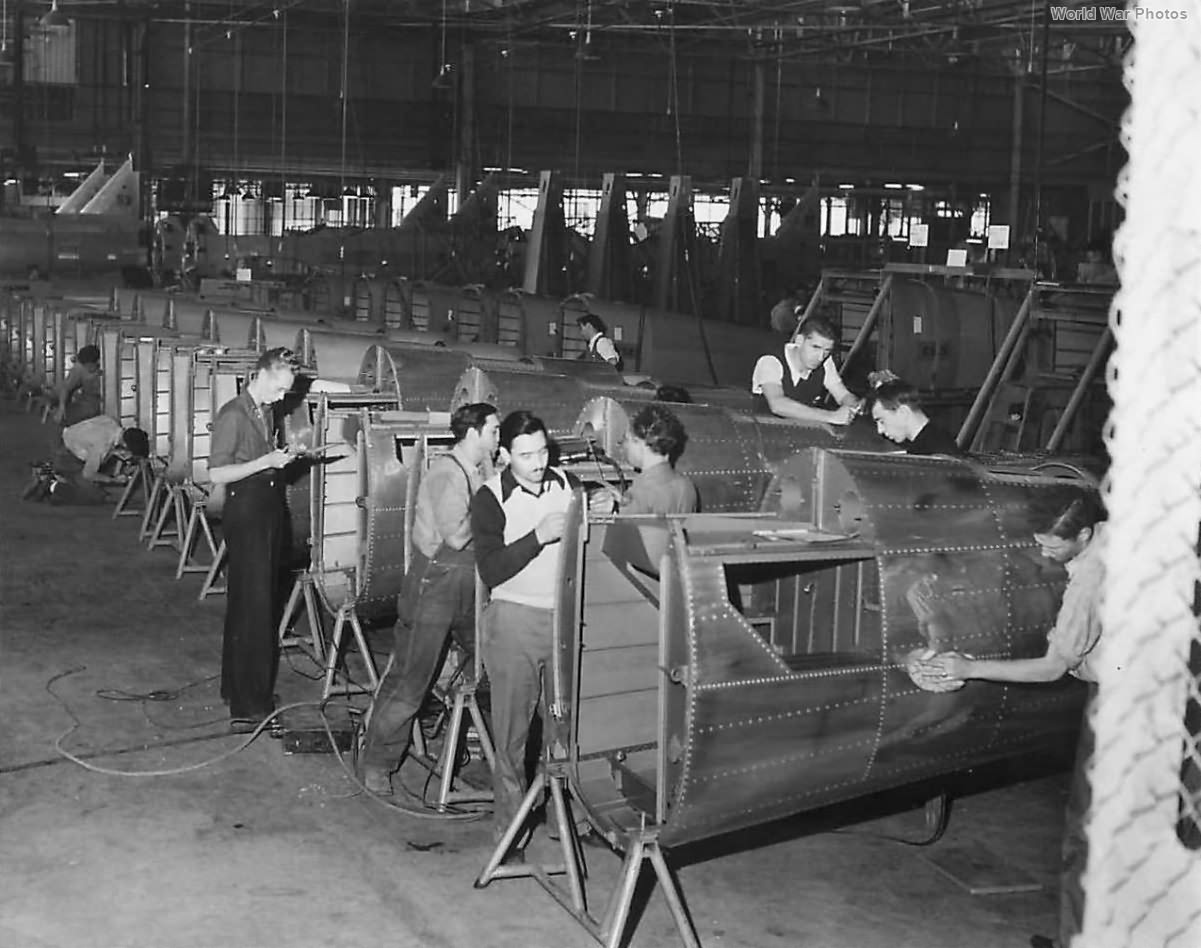 Workmen assembling fuselages of O-47B