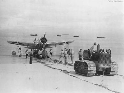 Marine tractor pulls OS2U on Funafuti Beach 1943