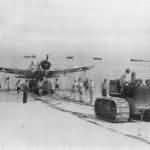 Marine tractor pulls OS2U on Funafuti Beach 1943