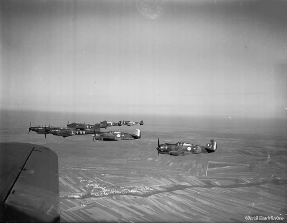 Battles of No. 88 Squadron RAF fly in formation with Hawk 75s of 1e escadrille GC I/2