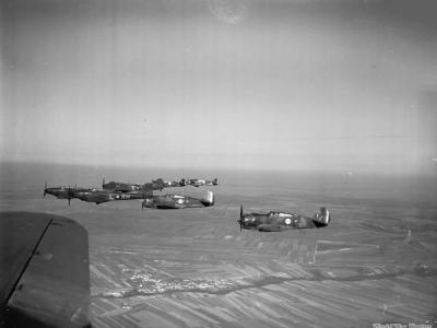 Battles of No. 88 Squadron RAF fly in formation with Hawk 75s of 1e escadrille GC I/2
