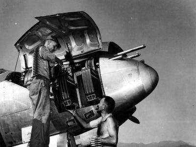 Armorers loading ammunition into a P-38 Lightning Of the 94th Fighter Squadron 1st Fighter Group Italy
