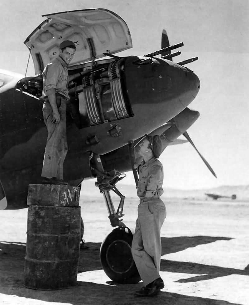 Ground crew member working on a P-38 pilot 2Lt Ward Kuentzel of the 96th FS 82nd FG