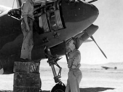 Ground crew member working on a P-38 pilot 2Lt Ward Kuentzel of the 96th FS 82nd FG