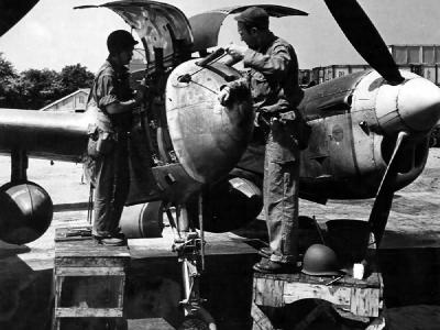 Ground crew members working on a P-38 Lightning England