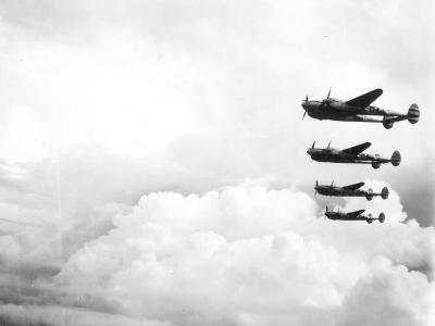 Lockheed P-38L Lightnings of 67th FS in flight during World War II
