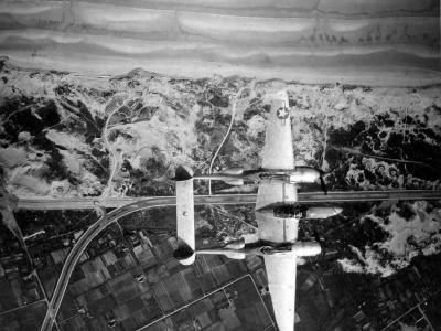 Lockheed P-38 Lightning Flies Over A Coast Line Near Ostend Belgium May 1945