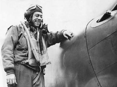 Lt Paul Fisher of the 38th Fighter Squadron 55th Fighter Group checks battle damage to his P-38 1944
