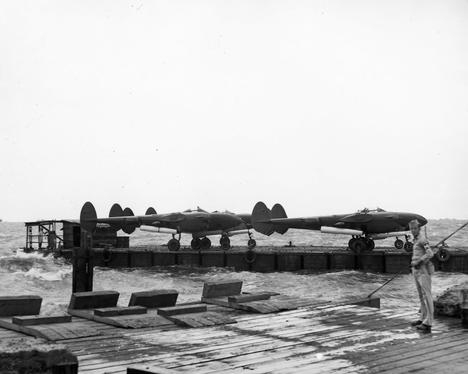 P-38 Lightning Fighters Barged ashore at Manila Docks 8 May 1945
