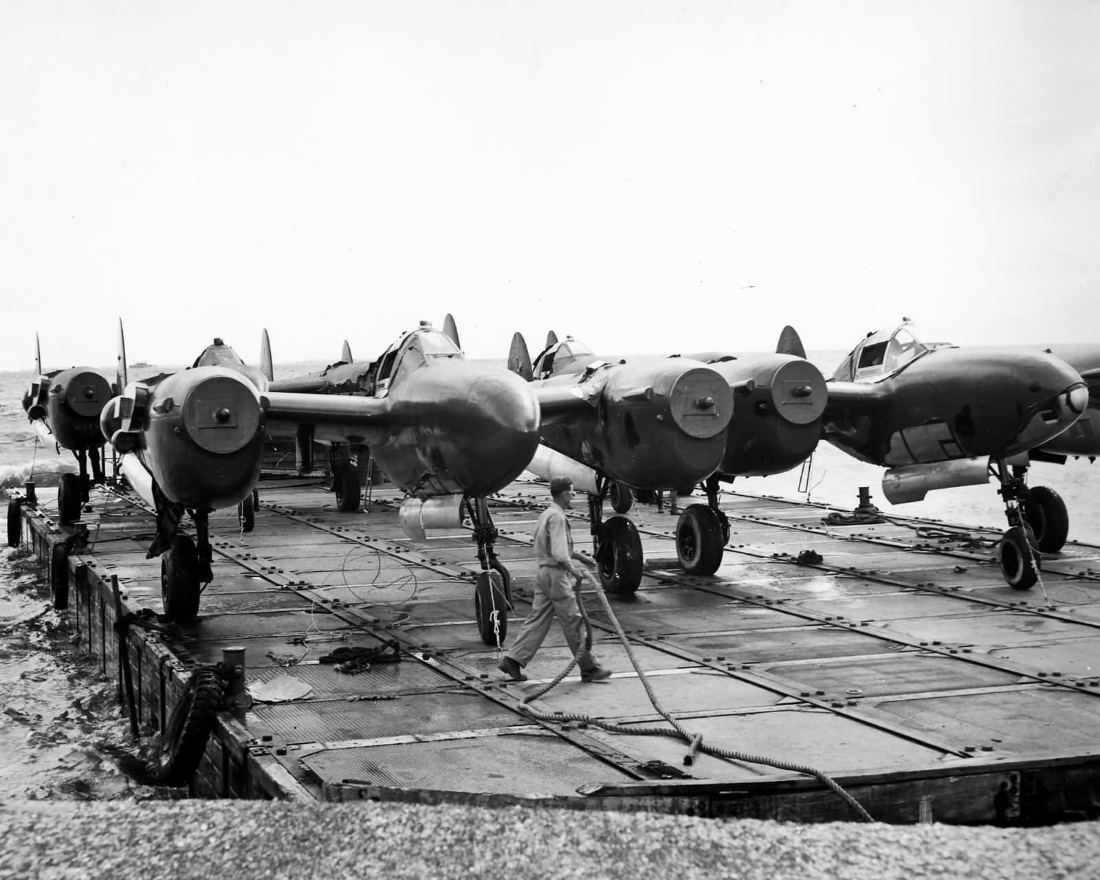 P-38 Lightning Fighters Barged ashore at Manila Docks 8 May 1945 2