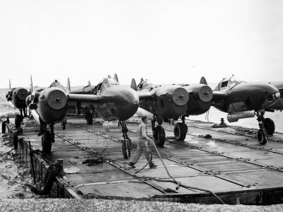 P-38 Lightning Fighters Barged ashore at Manila Docks 8 May 1945 2