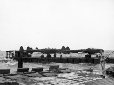P-38 Lightning Fighters Barged ashore at Manila Docks 8 May 1945