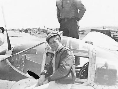 Pilot by Cockpit of His P-38 Fighter Plane