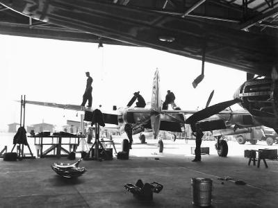 Soldiers Working on P-38 Lightning in Hanger in Australia 1942