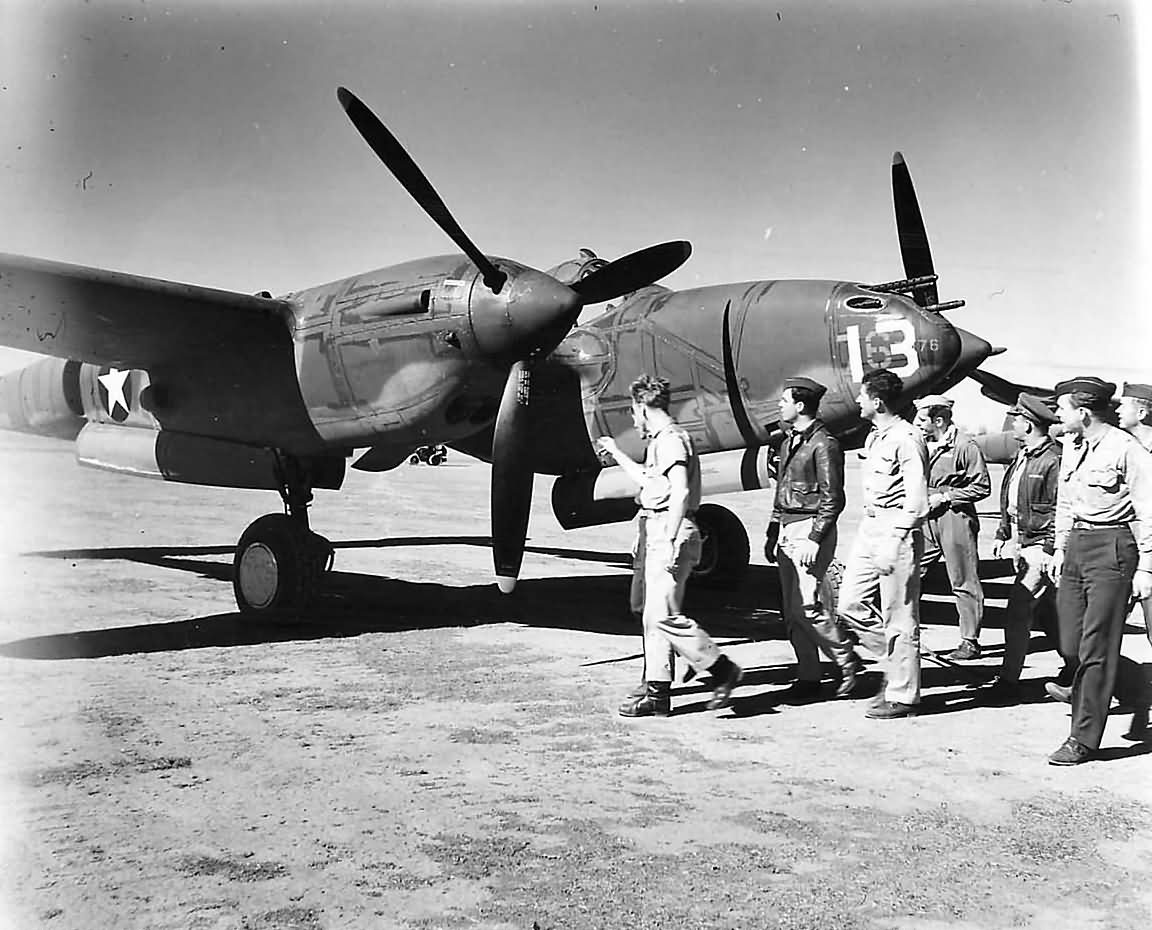 USAAF fighter pilots inspect a newly arrived P-38F Lightning #13, 39th FS 5th AF Australia 1942