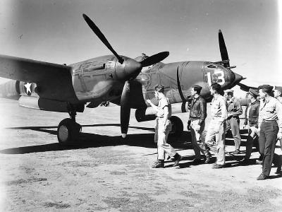 USAAF fighter pilots inspect a newly arrived P-38F Lightning #13, 39th FS 5th AF Australia 1942
