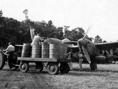 ground crewmen service a P-38 Lightning #74 of the 39th FS 35th Fighter Group, 28 February 1943