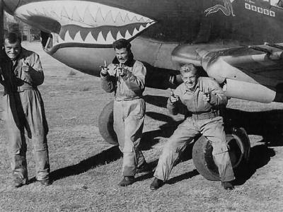 Flying Tiger AVG pilots and P-40B Tomahawk shark mouth nose art