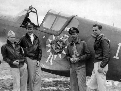 Former Members Of The AVG Serving With The 23rd Fighter Group Stand Beside A Curtiss P-40 With The Insignia Of The Group