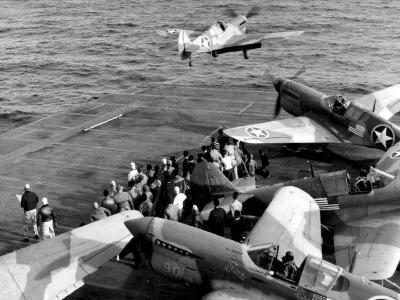 P-40F Warhawks 33rd FG take off from USS Chenango CVE-28 carrier North Africa