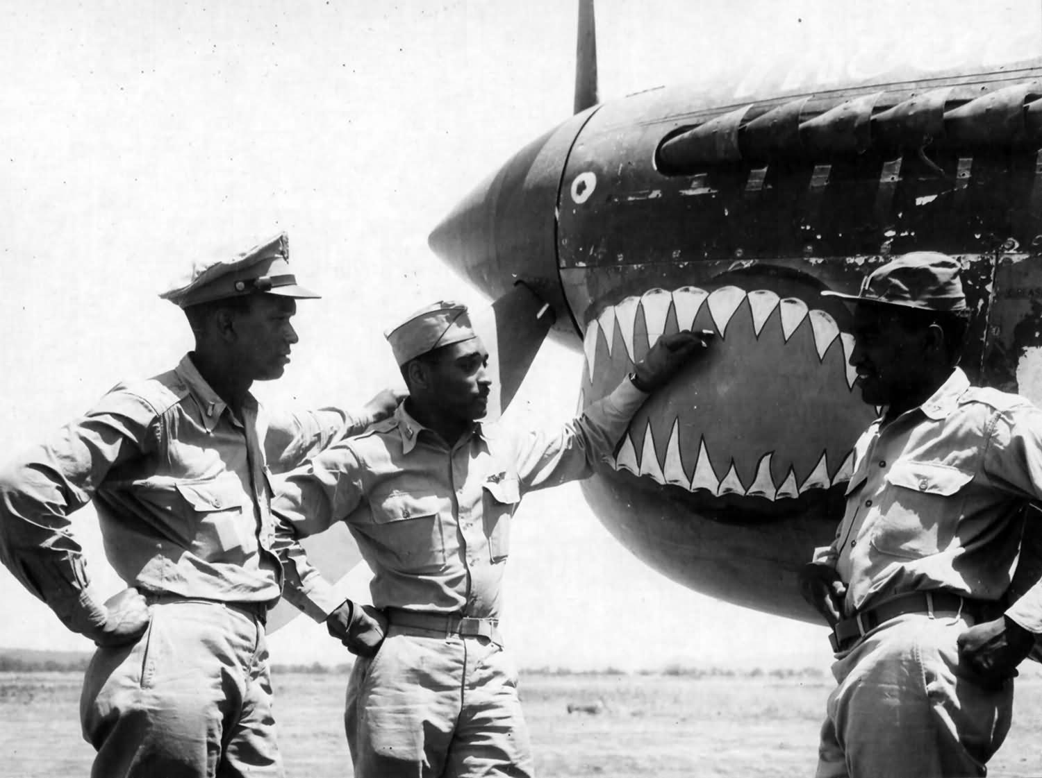 P-40 of the 332nd FG 99th Fighter Squadron. Pilots: 1st Lt Bolling Capt Lawrence jr and Capt Roberts Italy