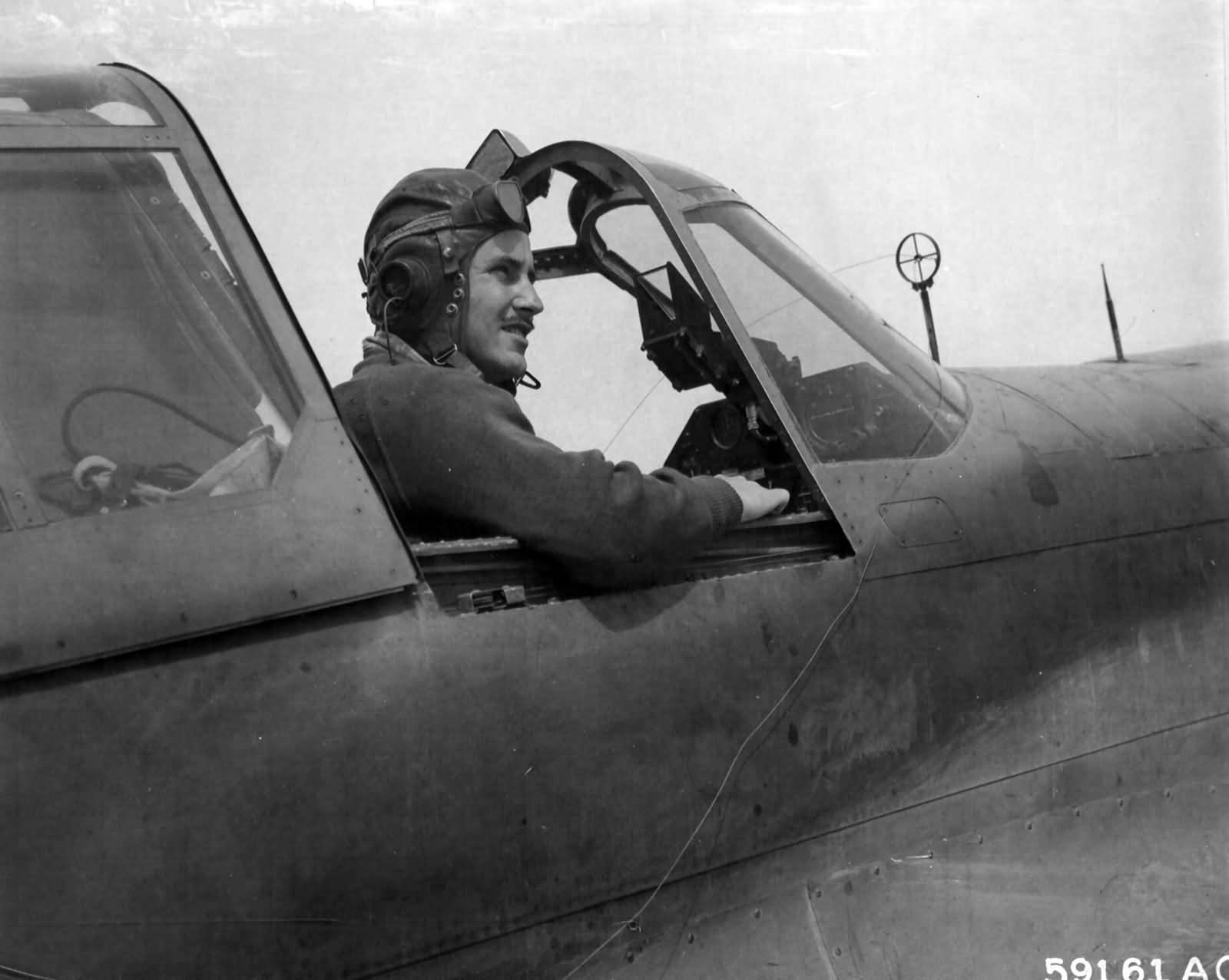 P-40 pilot of the 9th AF 57th Fighter Group in his plane ready for take off North Africa