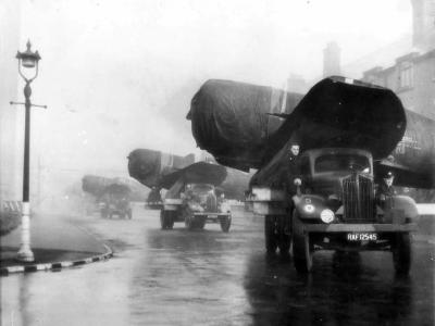 Convoy of P-47 Thunderbolts Pass thru English Town Enroute to Depot 1944