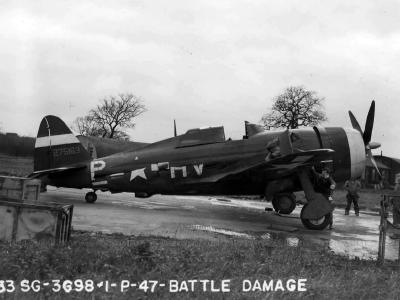 Damaged P-47 Thunderbolt Razorback named „Powers Girl” of the 56th Fighter Group, 61st FS. Pilot Capt Powers