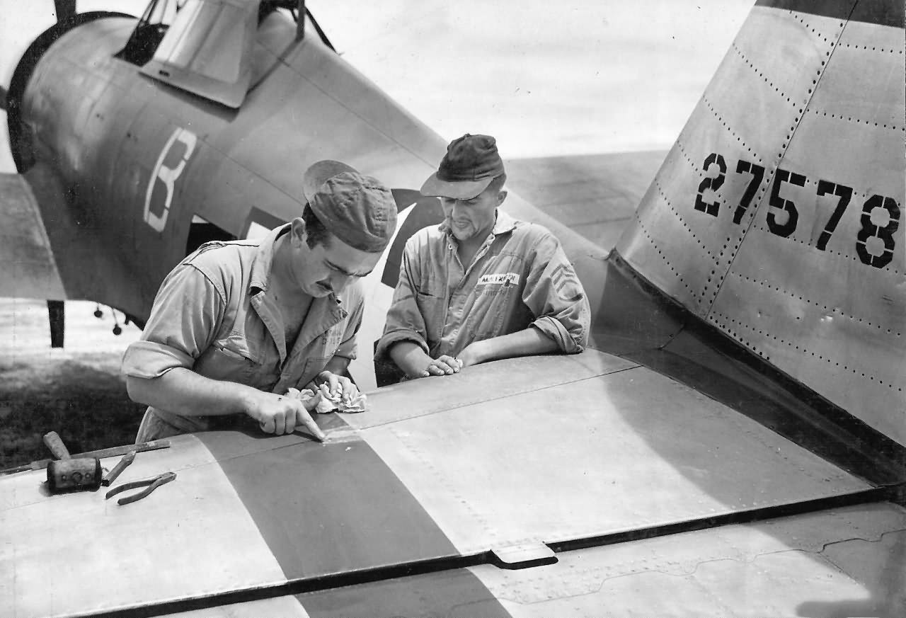 Ground Crew of the 318th FG repairing damage on P-47D