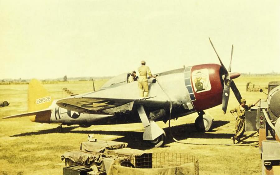 Ground personnel of the 358th Fighter Group refuel a P-47 Thunderbolt 42-28928