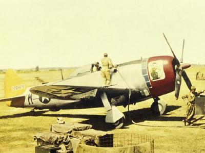 Ground personnel of the 358th Fighter Group refuel a P-47 Thunderbolt 42-28928