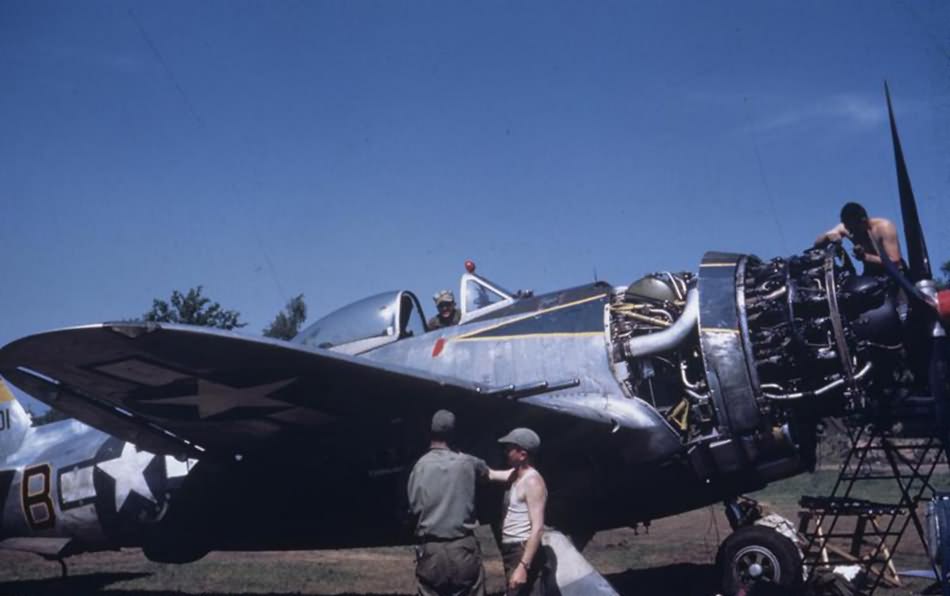 Ground personnel of the 406th FG, 514th Fighter Squadron conduct engine checks to a P-47 O7-B 42-28401 at Handorf April 1945