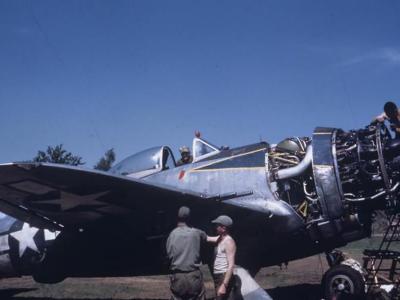 Ground personnel of the 406th FG, 514th Fighter Squadron conduct engine checks to a P-47 O7-B 42-28401 at Handorf April 1945