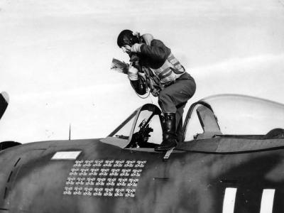 Lt. Col. Francis S. ‚Gabby’ Gabreski of the 61st Fighter Squadron, 56th Fighter Group climbs out of a P-47 Thunderbolt Bubbletop cockpit