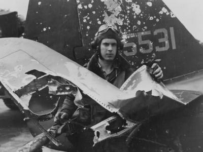 Lt Casteel of the 63rd FS, 56th FG stands beside his battle damaged P-47 UN-A 43-25531 – May 1944